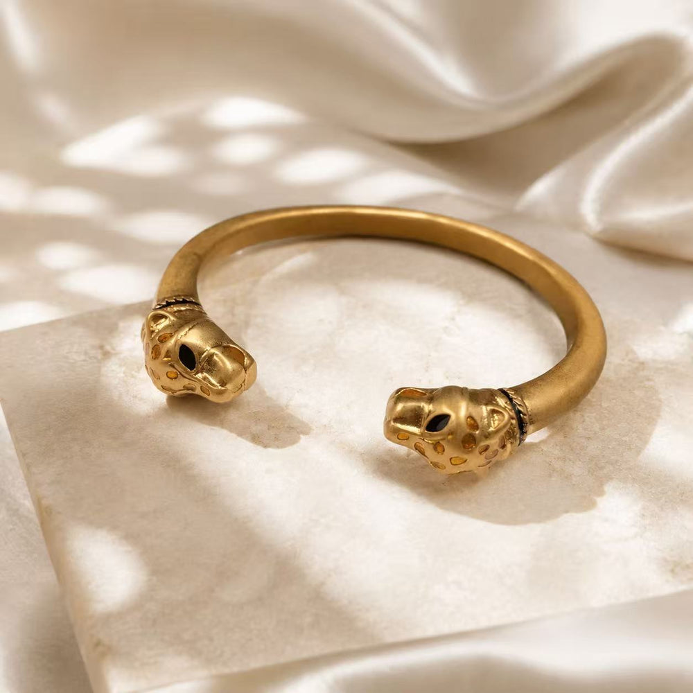 Gold-tone double leopard head open cuff bracelet front view