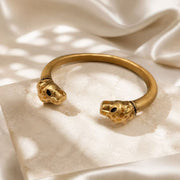 Gold-tone double leopard head open cuff bracelet front view