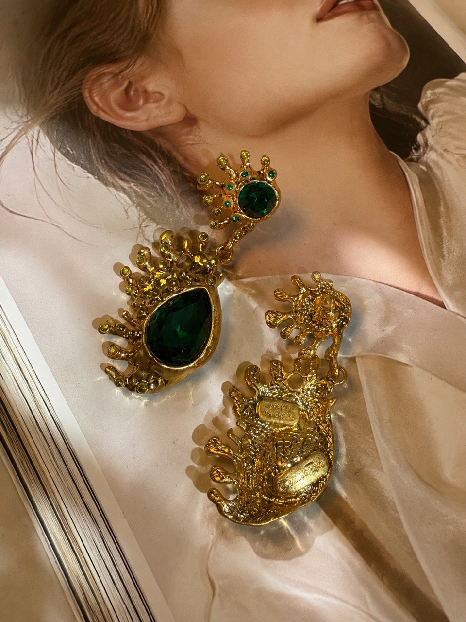Gold-tone emerald green crystal-style teardrop stud earrings back detail