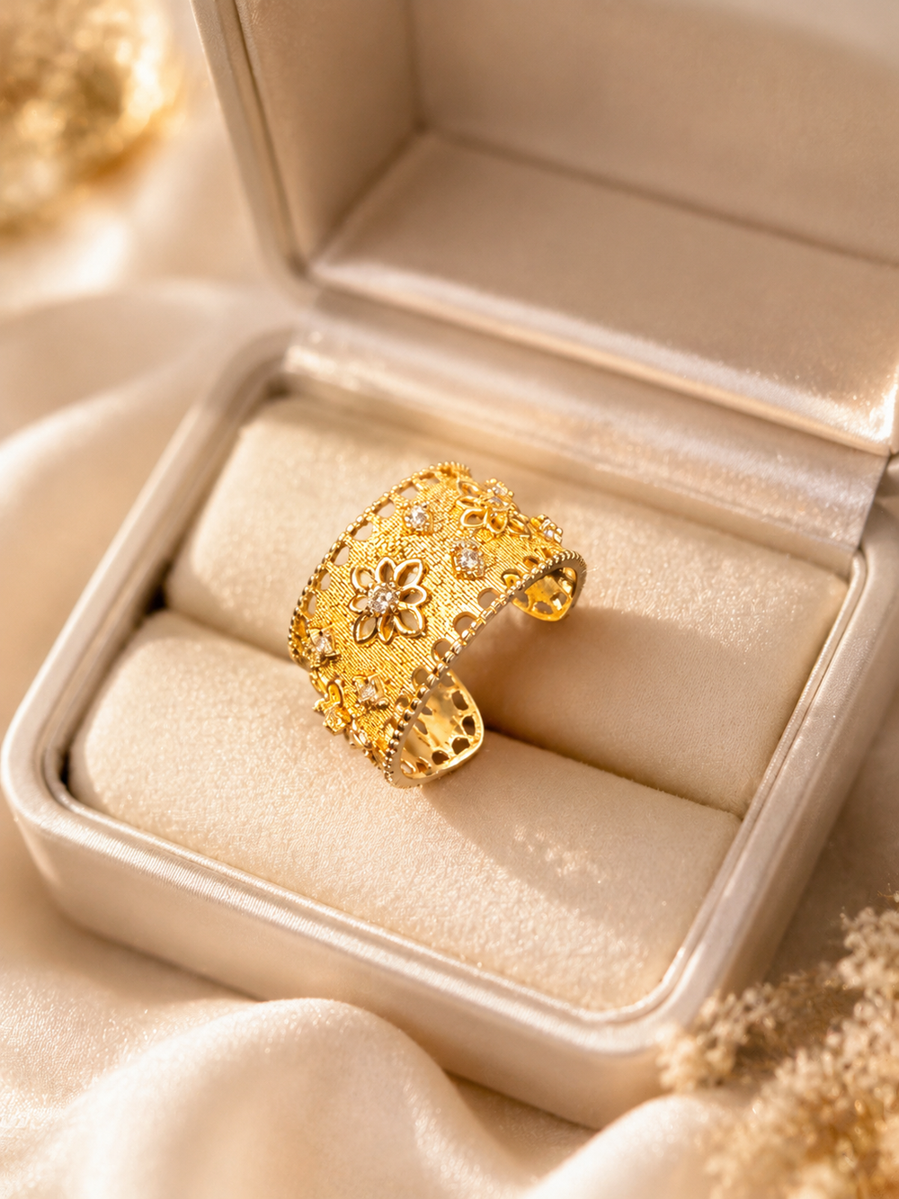 Gold-tone floral adjustable open ring with crystal-style accents front view