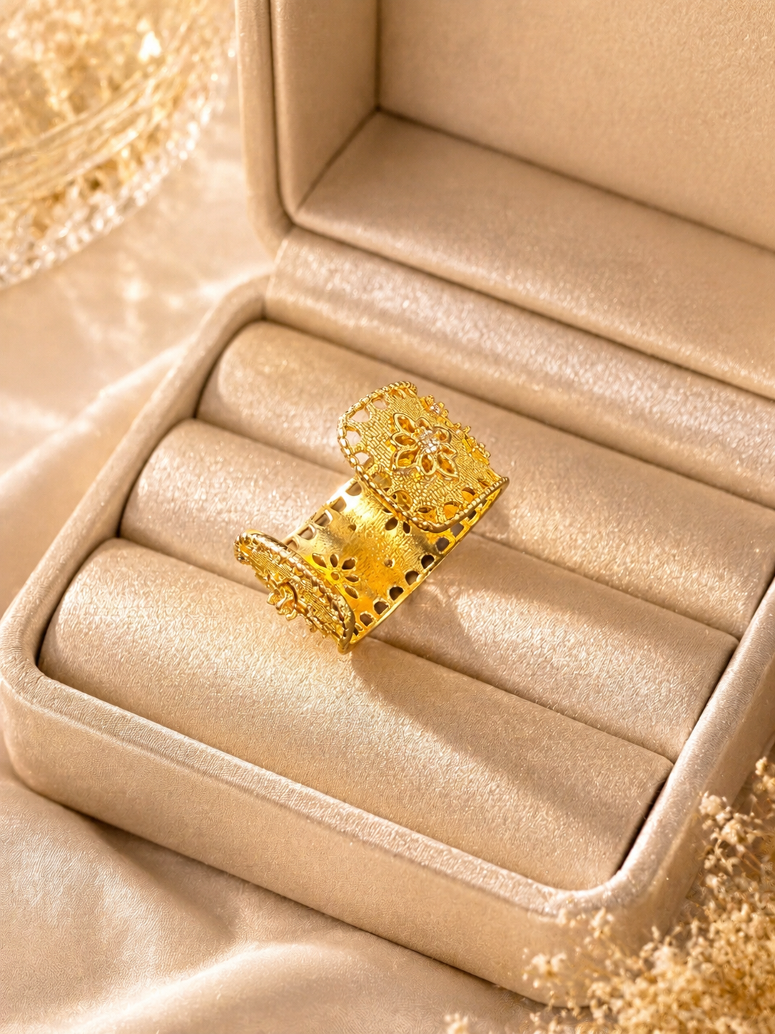 Gold-tone floral adjustable open ring showing open band side view