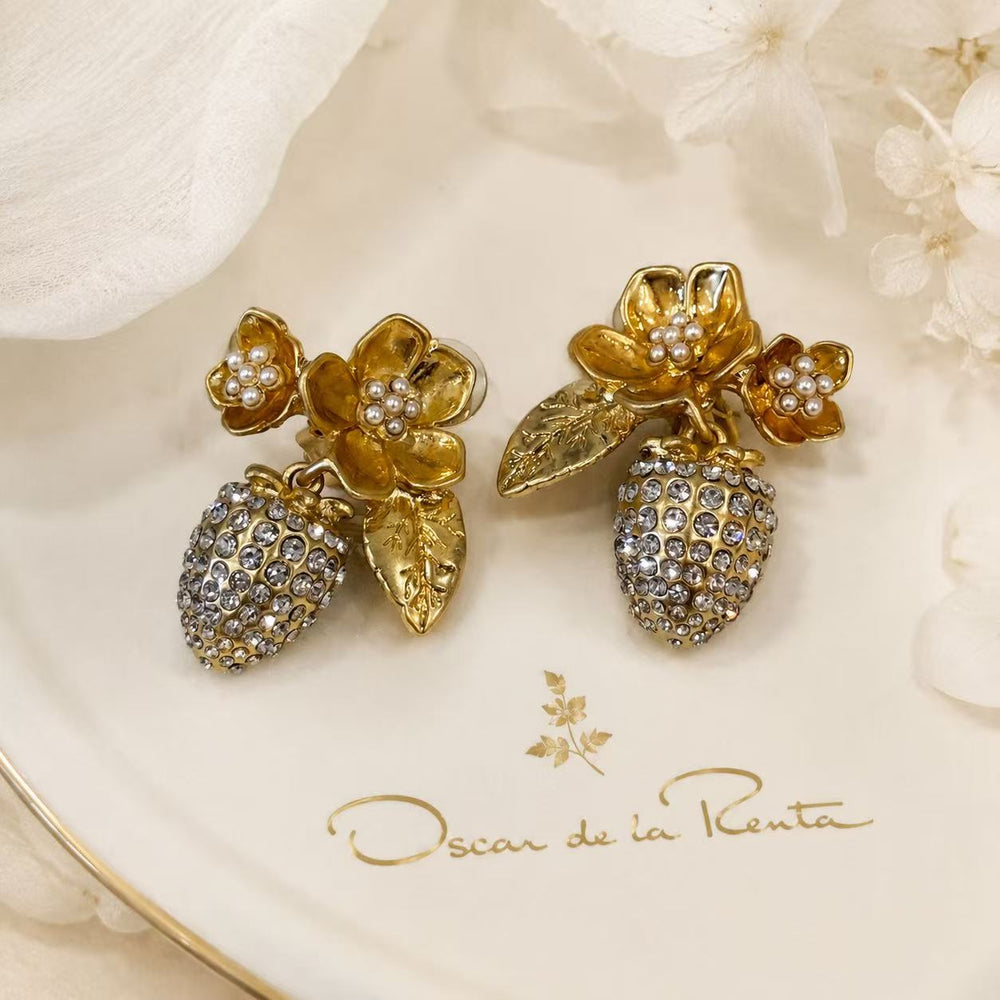 Gold-tone floral pearl-style drop clip-on earrings front view