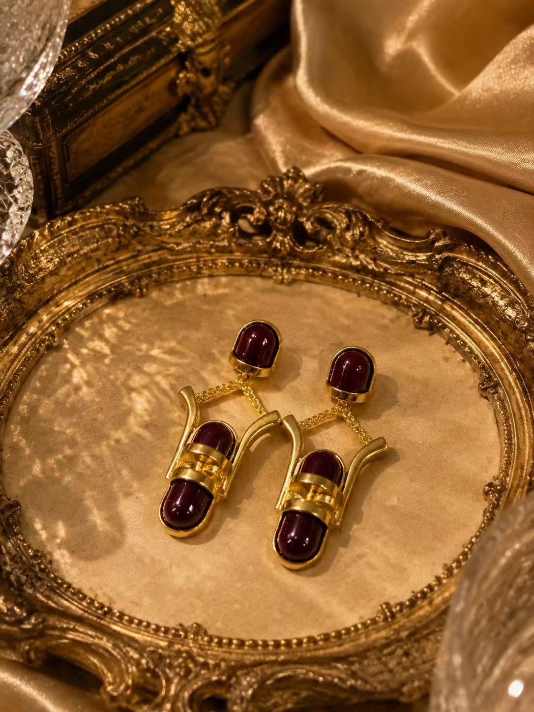 Gold-tone burgundy glass-style geometric drop stud earrings