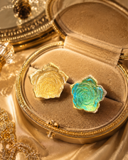 Gold-tone glass rose adjustable rings in clear and sky blue