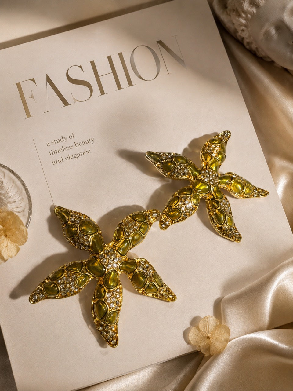 Gold-tone Golden Olive crystal-style starfish stud earrings pair display
