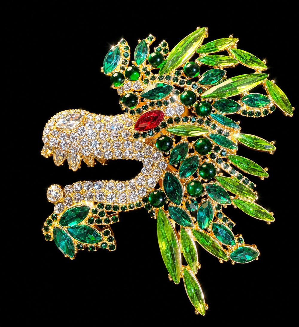 Gold-tone green crystal-style dragon head statement brooch front view