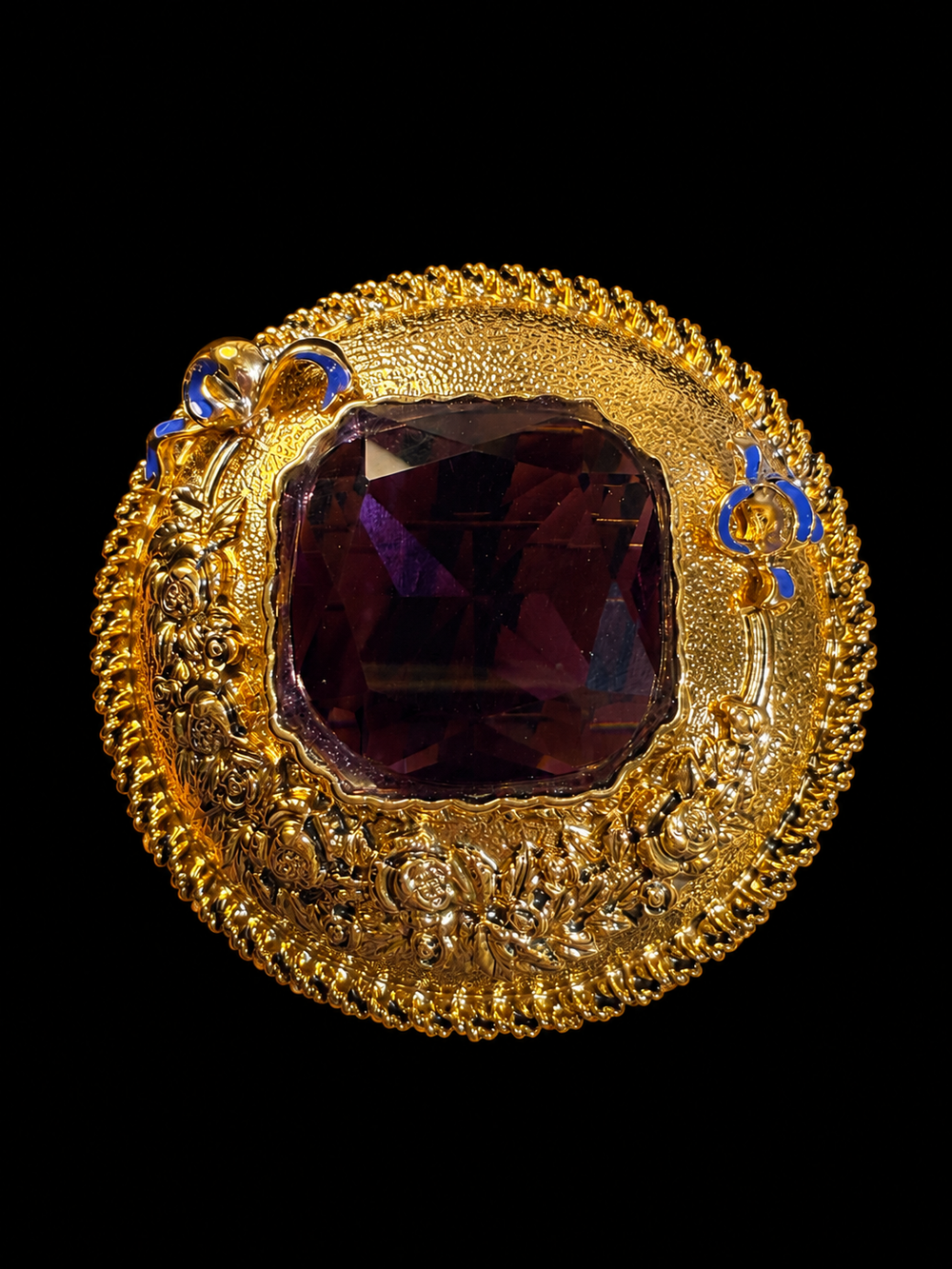 Gold-tone large glass crystal-style statement brooch front view with ornate round frame