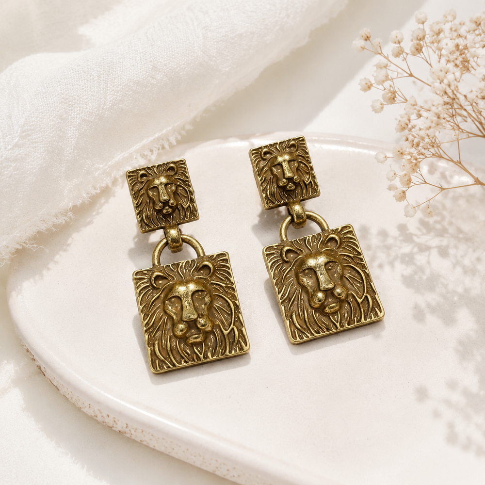 Gold-tone lion-head pendant drop stud earrings front view