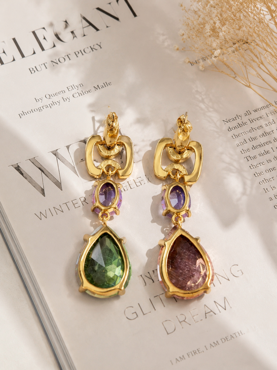 Gold-tone multicolor crystal-style drop stud earrings detail view