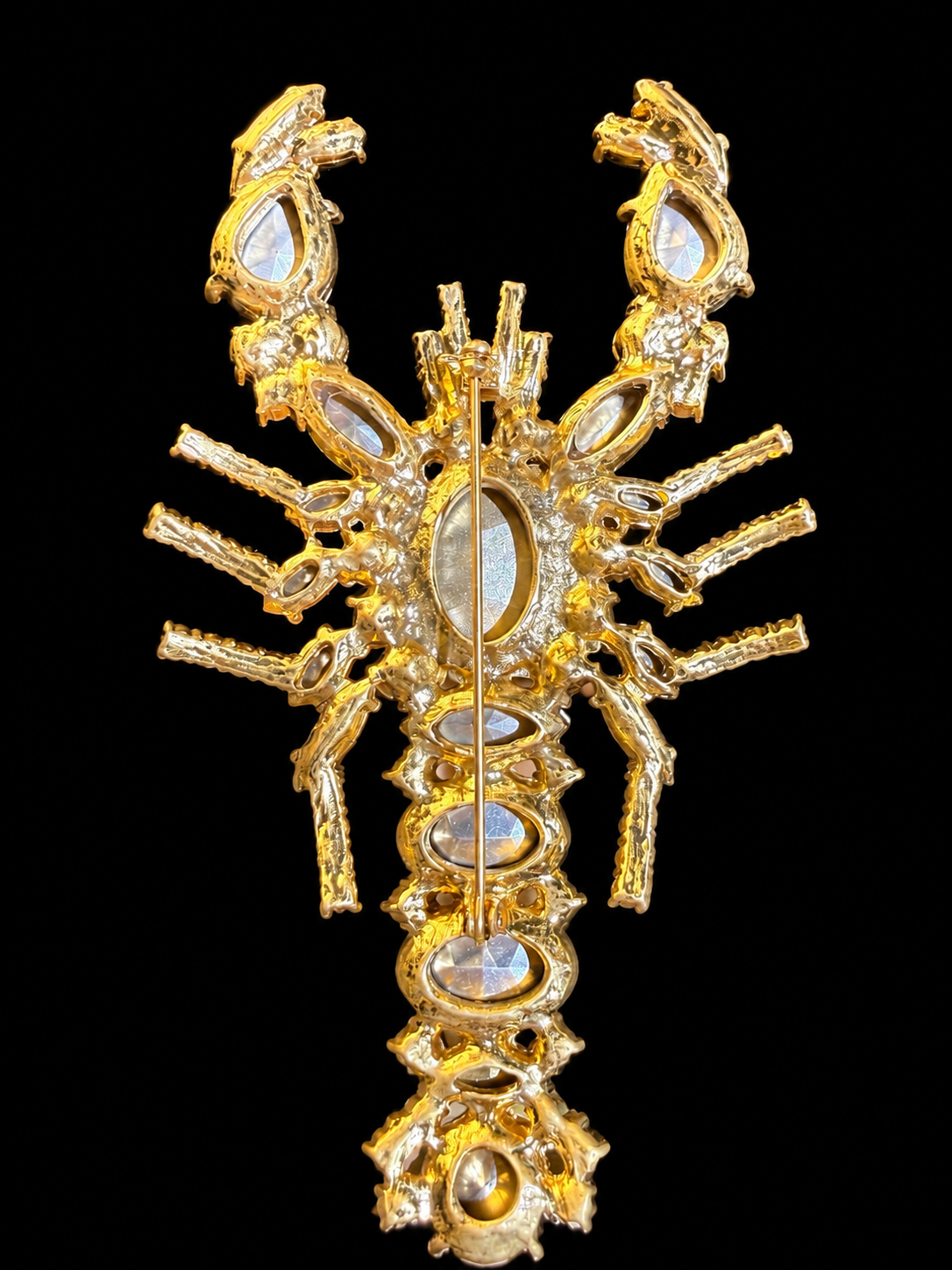 Gold-tone multicolor crystal-style lobster brooch back view with pin closure