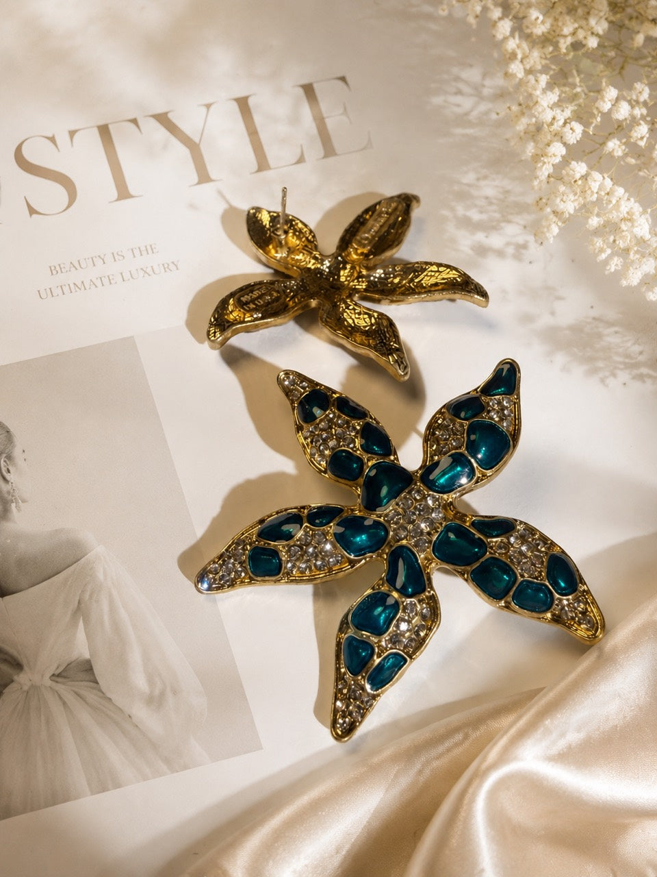 Gold-tone Ocean Teal crystal-style starfish stud earrings front and back detail