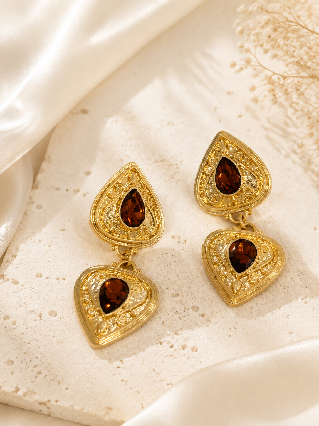Gold-tone ornate brown teardrop crystal-style-style dangle earrings front view