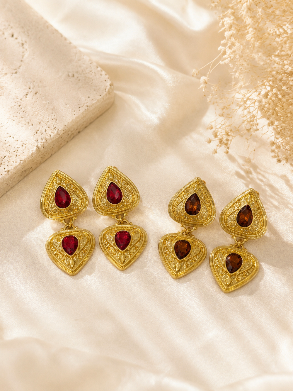 Gold-tone ornate teardrop crystal-style dangle earrings in red and brown