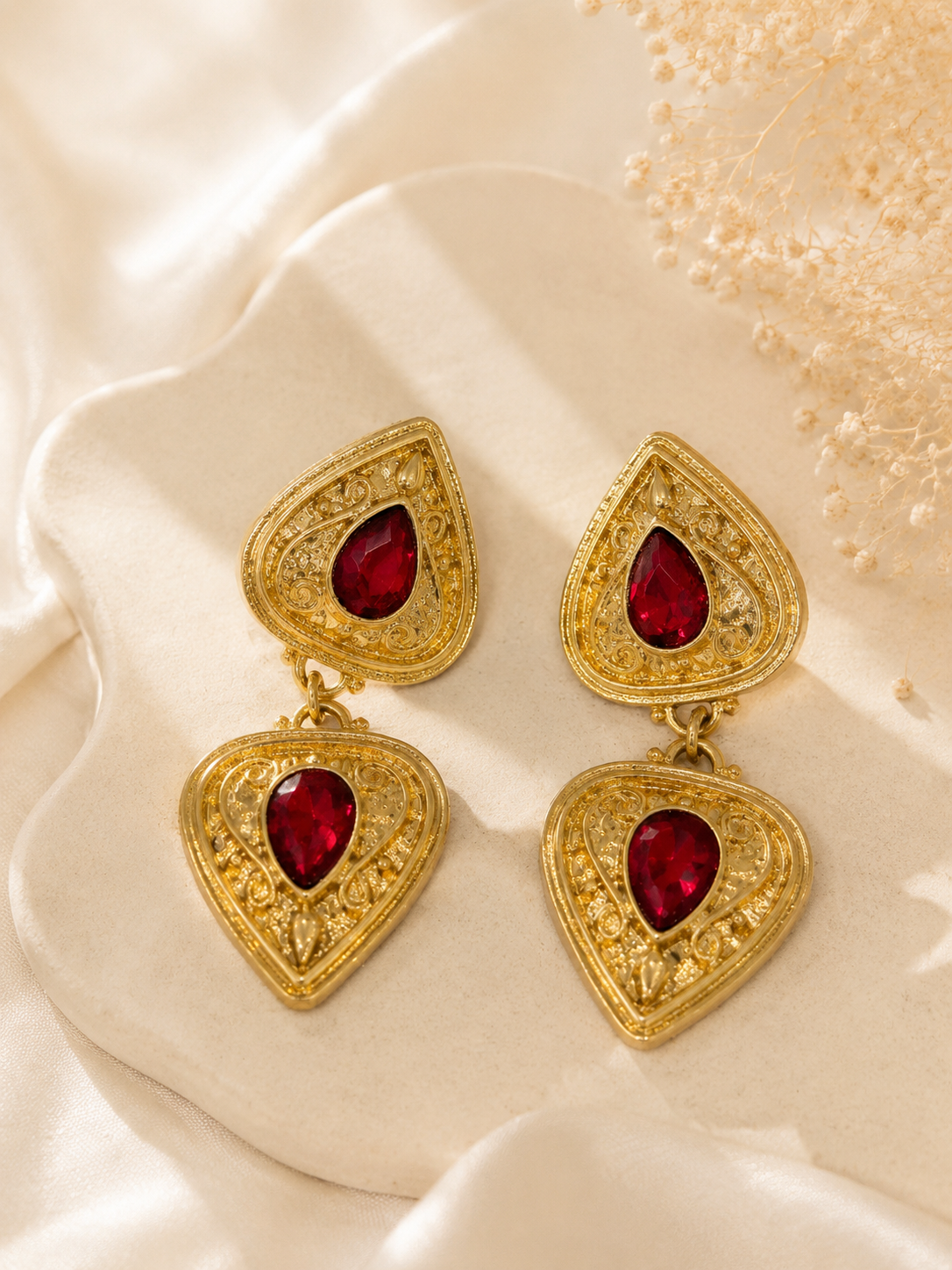 Gold-tone ornate red teardrop crystal-style-style dangle earrings front view