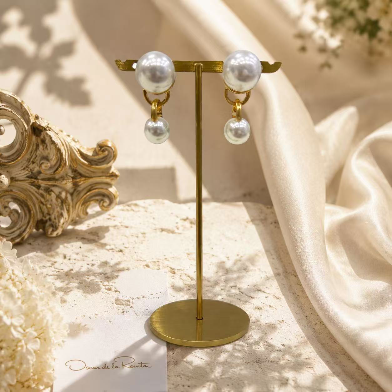 Gold-tone pearl-style-style double-sphere drop stud earrings display view