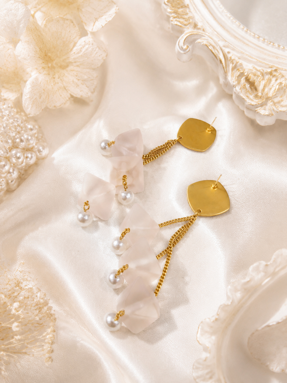 Back view of gold-tone petal drop earrings showing straight stud posts