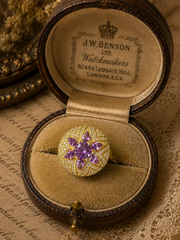 Gold-tone purple crystal-style flower adjustable open ring front view