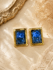 Gold-tone rectangular blue glass-style stud earrings front view