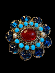 Gold-tone red and blue resin-style floral statement brooch angled front view