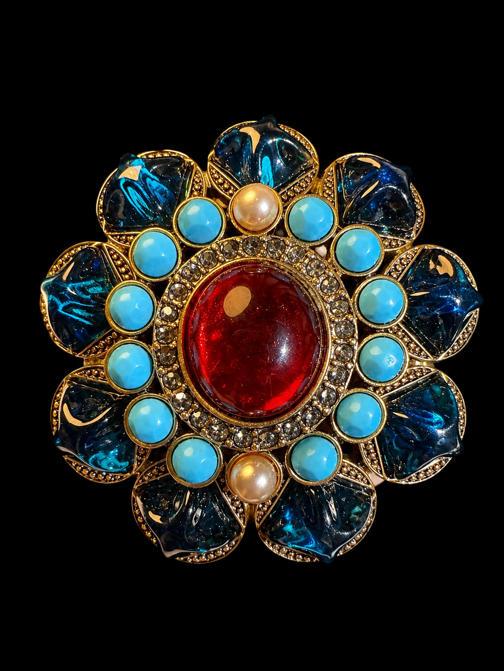 Gold-tone red and blue resin-style floral statement brooch front view