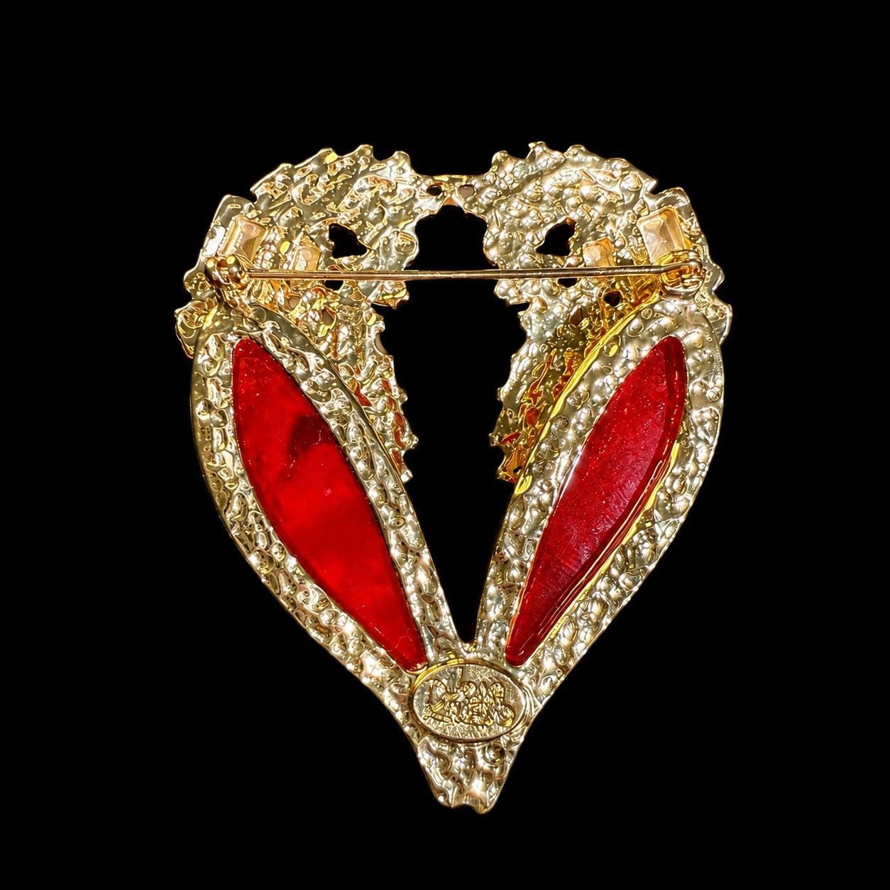 Gold-tone red crystal-style winged heart statement brooch back pin view