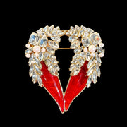 Gold-tone red crystal-style winged heart statement brooch front view