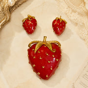 Gold-tone red enamel-style strawberry brooch and clip-on earrings set front view