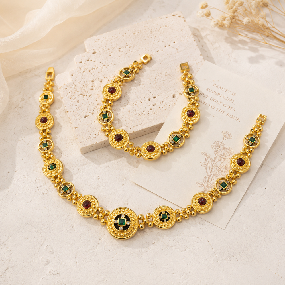 Gold-tone red and green crystal-style necklace