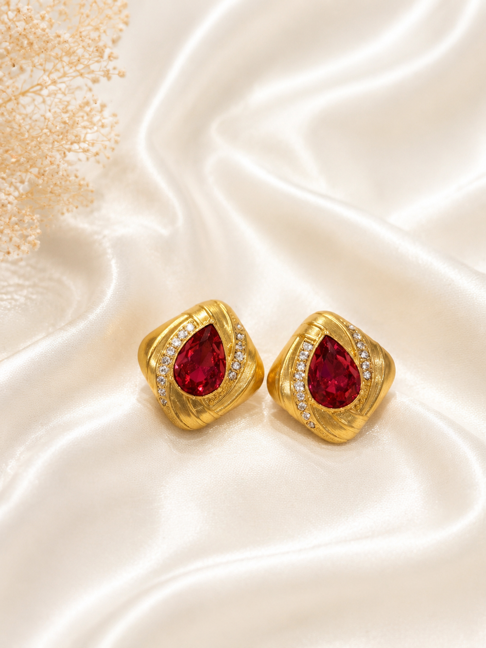Gold-tone rose-pink teardrop crystal-style square stud earrings front view