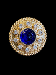 Gold-tone round blue cabochon-style crystal-style brooch pendant front view