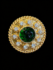 Gold-tone round green cabochon-style crystal-style brooch pendant front view
