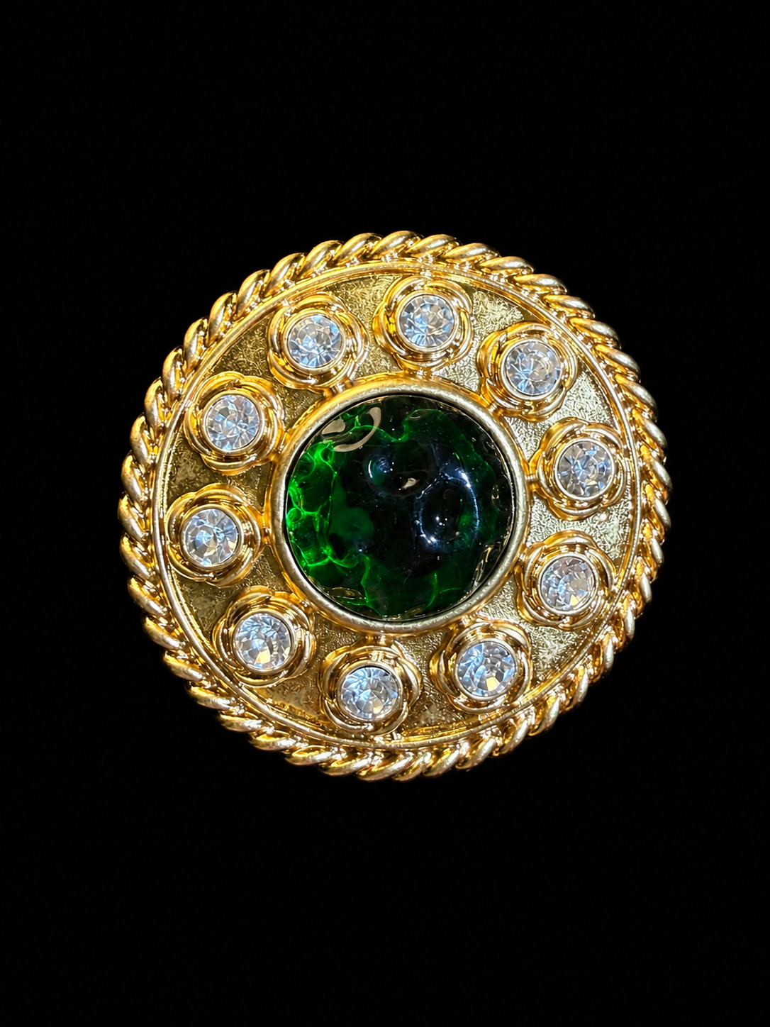 Gold-tone round green cabochon-style crystal-style brooch pendant front view