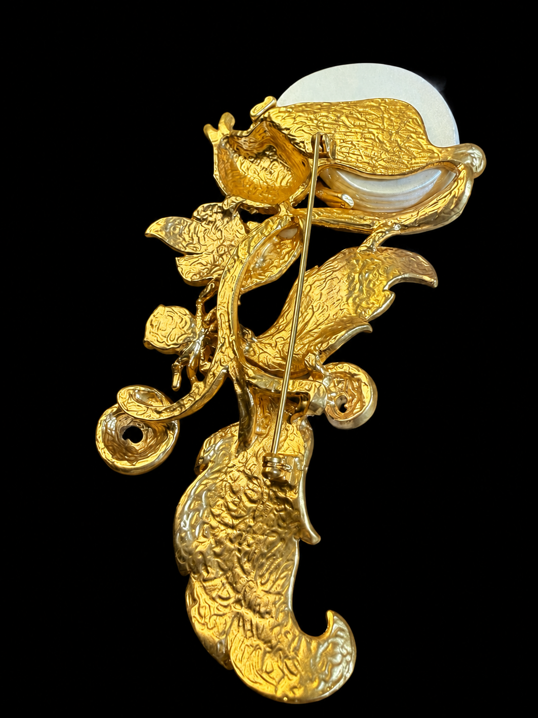 Gold-tone snail and leaf statement brooch back view with pin closure