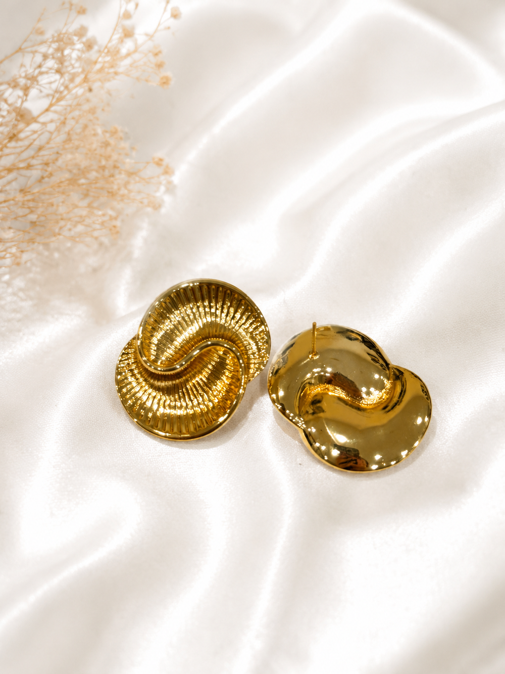 Gold-tone textured statement stud earrings front view