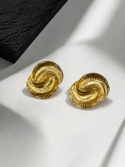Gold-tone textured statement stud earrings detail view