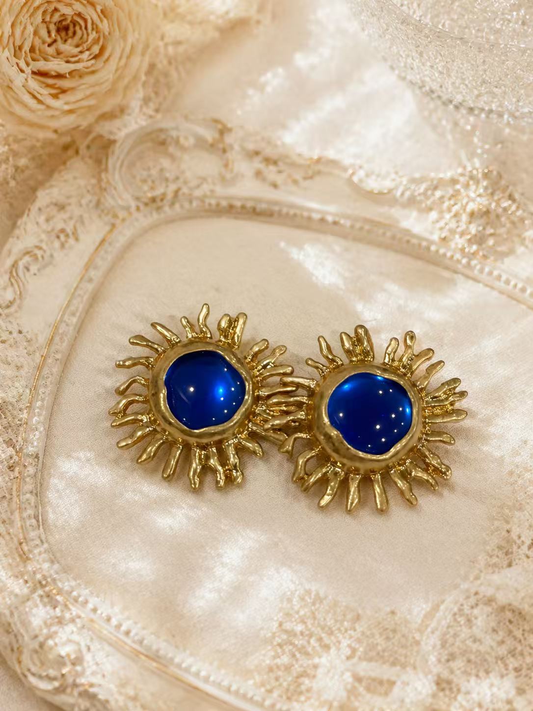 Gold-tone sky blue sunflower glass-style stud earrings