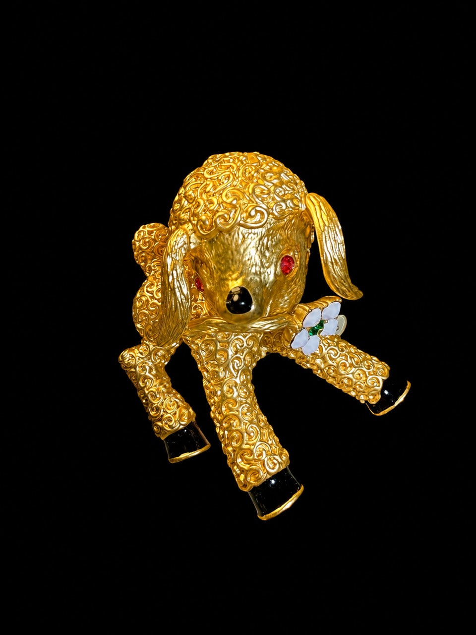 Gold-tone textured lamb statement brooch front view with flower accent