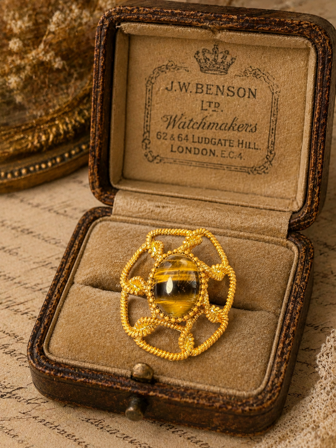 Gold-tone tiger eye-style large adjustable open ring front view
