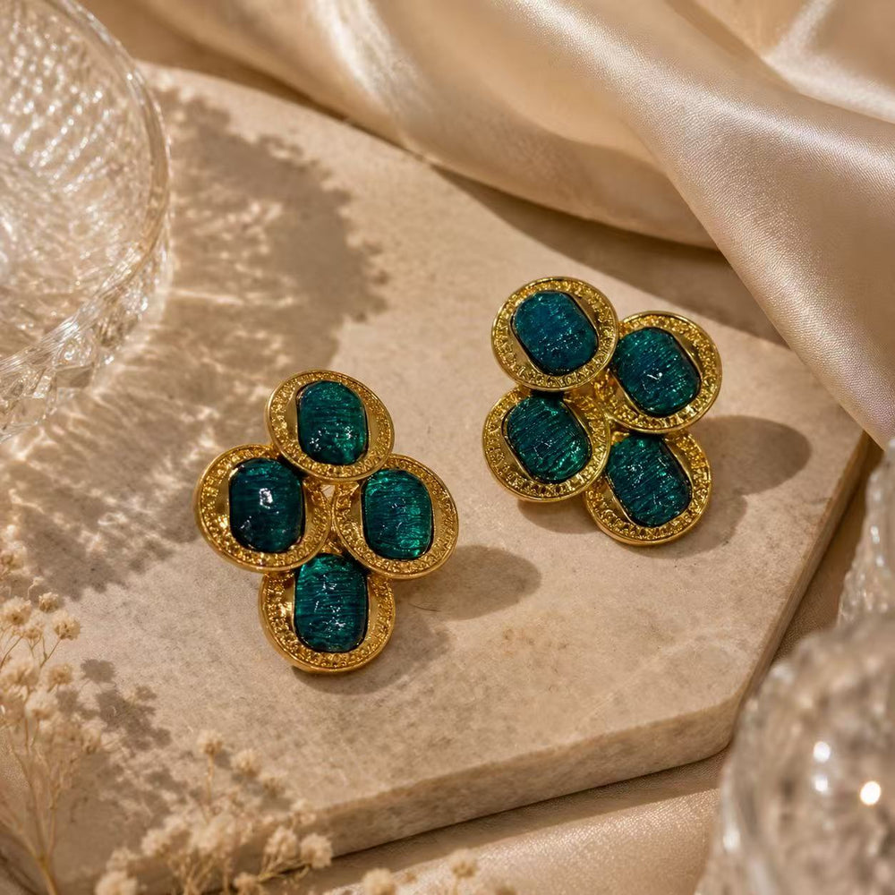 Gold-tone vintage-inspired teal blue glass-style cluster stud earrings front view