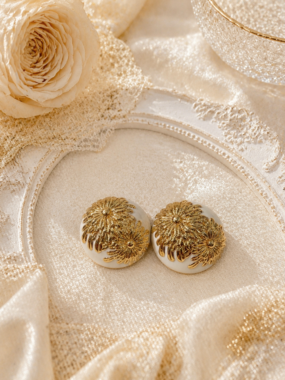 Gold-tone white floral stud earrings front view