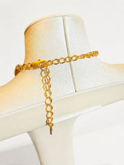 Gold-tone woven chain necklace clasp and extender detail