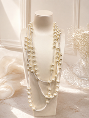 Layered pearl-style statement necklace front display on bust