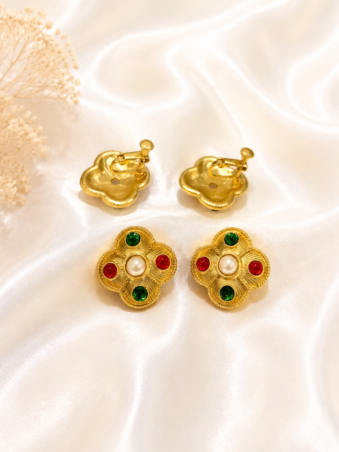 Gold-tone multicolor flower earrings with pearl-style centers, red and green accents, and clip-on backs
