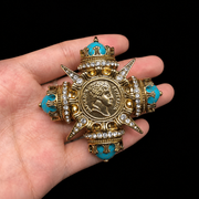 Coin-inspired brooch pendant with turquoise-style accents, detail view