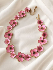 Pink enamel floral statement necklace on ivory fabric