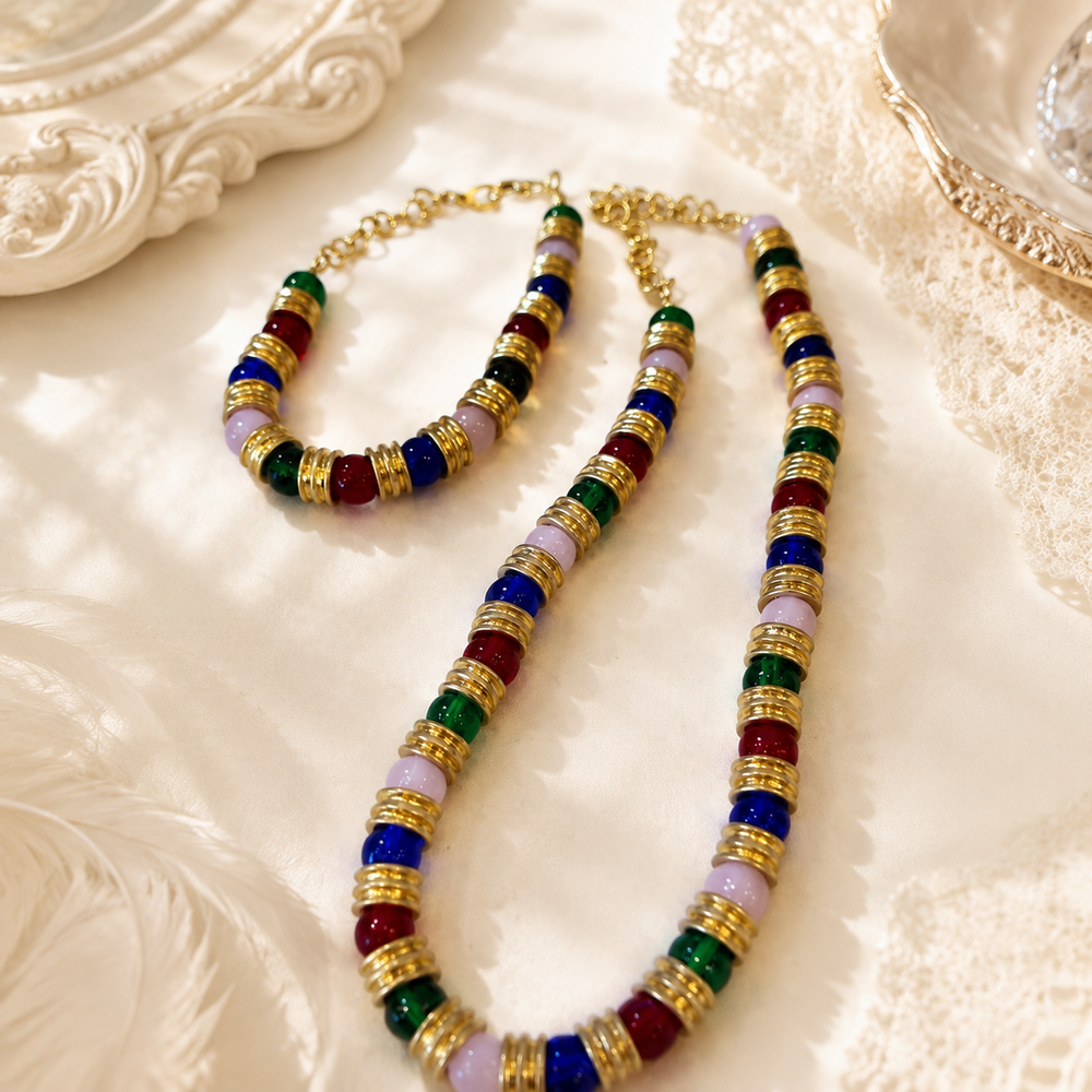 Colorful glass-style bead necklace and bracelet with gold-tone spacers