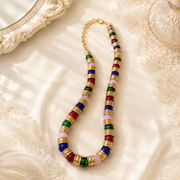 Colorful glass-style bead necklace with gold-tone spacers
