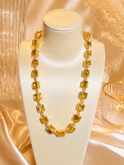Gold-tone glass rhinestone cube link statement necklace in golden yellow front view