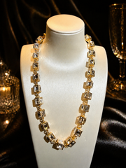 Gold-tone glass rhinestone cube link statement necklace in transparent clear front view