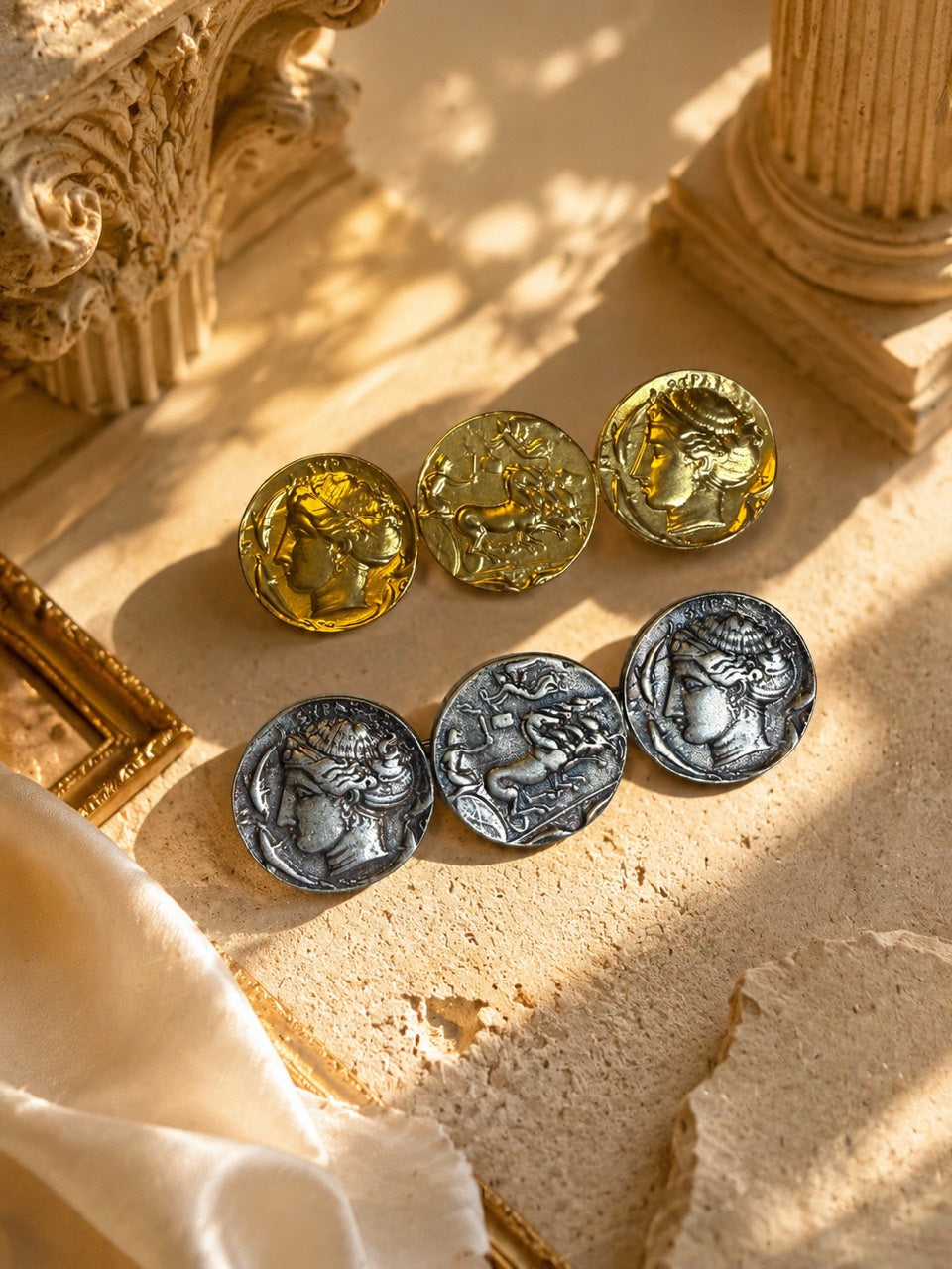 Gold-tone and silver-tone double-sided coin-style brooch front view